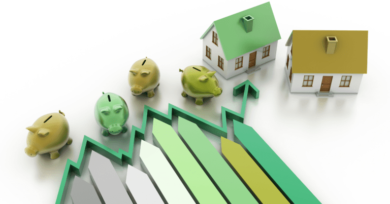 A miniature of residences and piggy banks arranged with financial analysis in the background. Contact our small business accountants in Sydney to help you with your financial planning.