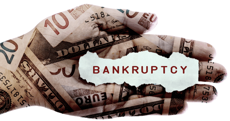 A hand with a tattoo of dollar bills and the word "bankruptcy" written on the palm. Contact our small business accountants for expert financial guidance to help you avoid bankruptcy.
