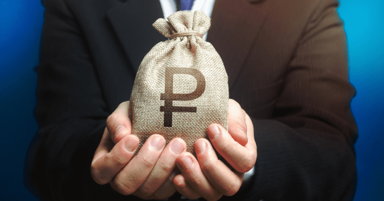 A person holding a sack filled with coins in it, possibly savings or profits for their business, seeking advice from a trusted tax accountant to manage their finances better.