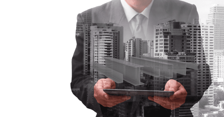A business accountant holding a gadget with a silhoutte of some industrial buildings and materials.