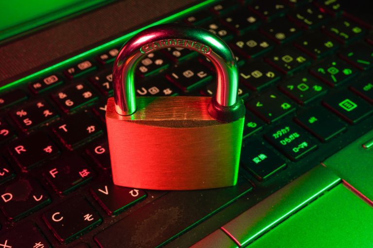 A lock on top of a laptop keyboard emphasises cybersecurity's crucial role in safeguarding SMSFs (Self-Managed Super Funds), particularly for accounting firms in Sydney.