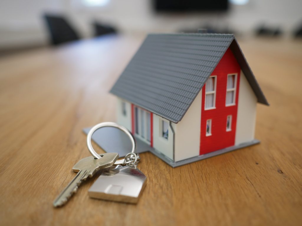 Image of a house with a key, representing properties and considerations for property accountants