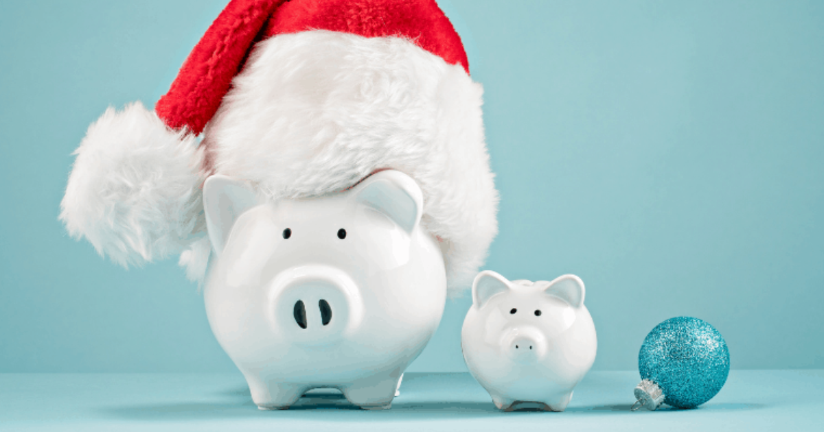 Two piggy banks adorned with Christmas outfits, one wearing a Santa hat, ready for the festive season. Contact our small business accountants to help you manage your finances and plan for the holidays.