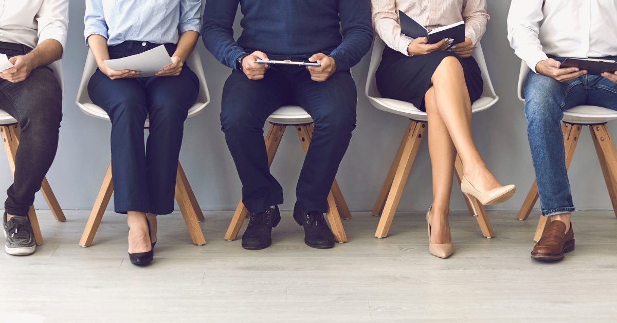 A row of individuals sitting on chairs, waiting for their job interviews. Trust our experienced business accountants in Chatswood to help you manage your financials, while you focus on growing your business.