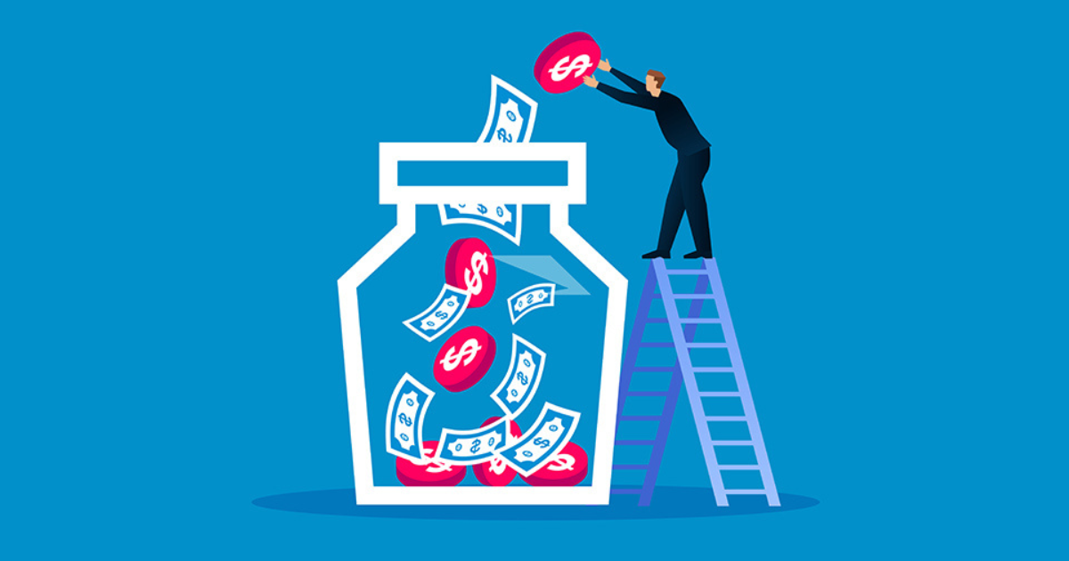 A man standing on a ladder and dropping bills and coins into a large glass jar. Contact our accounting firm in Sydney to help you manage your finances and savings effectively.