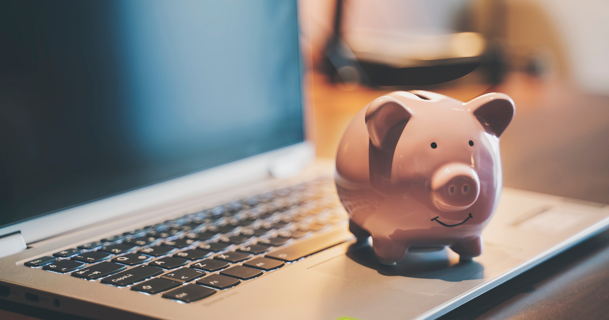 An image of a piggy bank resting on top of a laptop, representing the concept of financial savings and management. Let our business accountants in Sydney assist you in achieving your financial objectives with professional advice and support.
