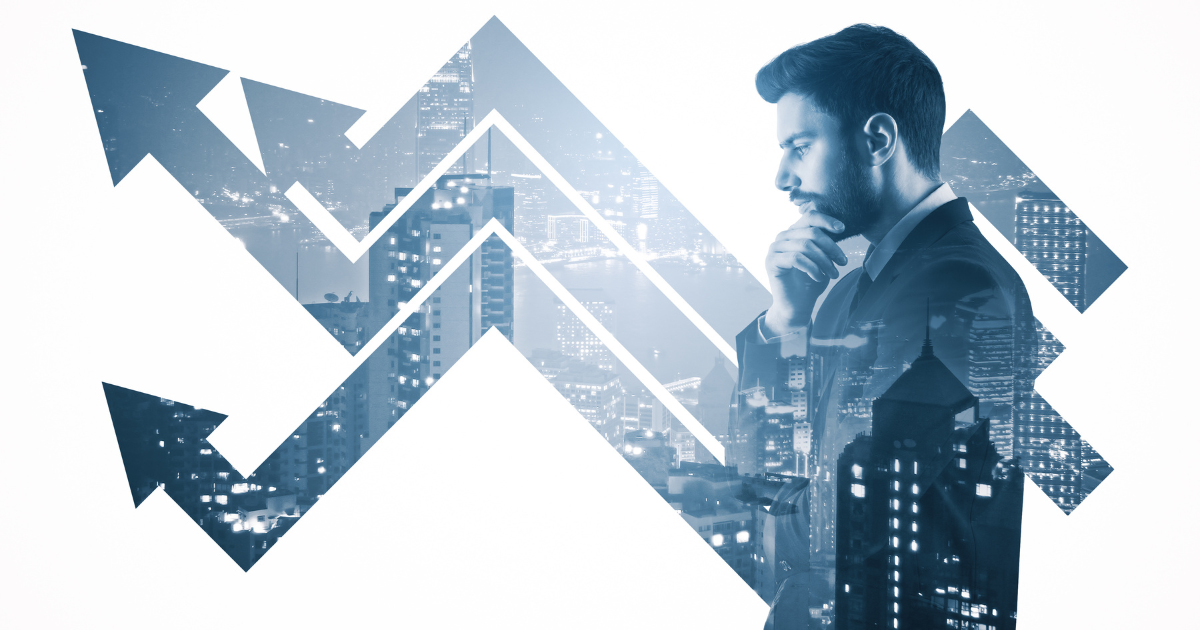 A person in deep thought with fluctuating arrows and an industrial setting as the watermark. Contact our business accountant for financial advice and strategies to navigate market fluctuations and grow your business.