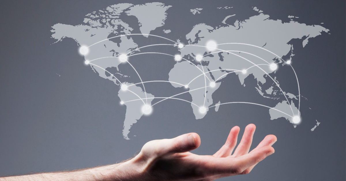 A hand holding a floating global map with dots illustrating international business connections. Our team of small business accountants in Sydney can help your company achieve financial success on a global scale.
